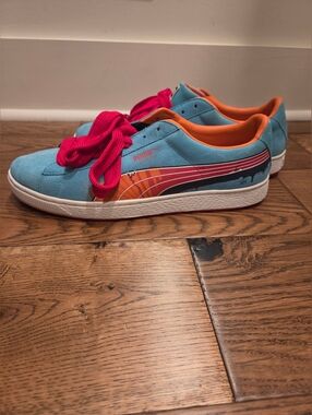 Puma Suede Low-Top Sneakers in Light Blue with Red Laces